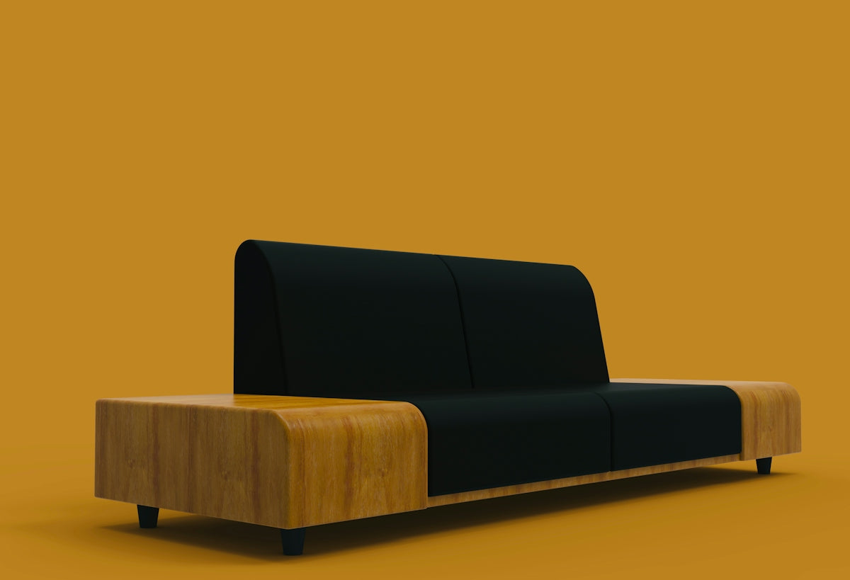 Modern black sofa with wooden accents on orange background